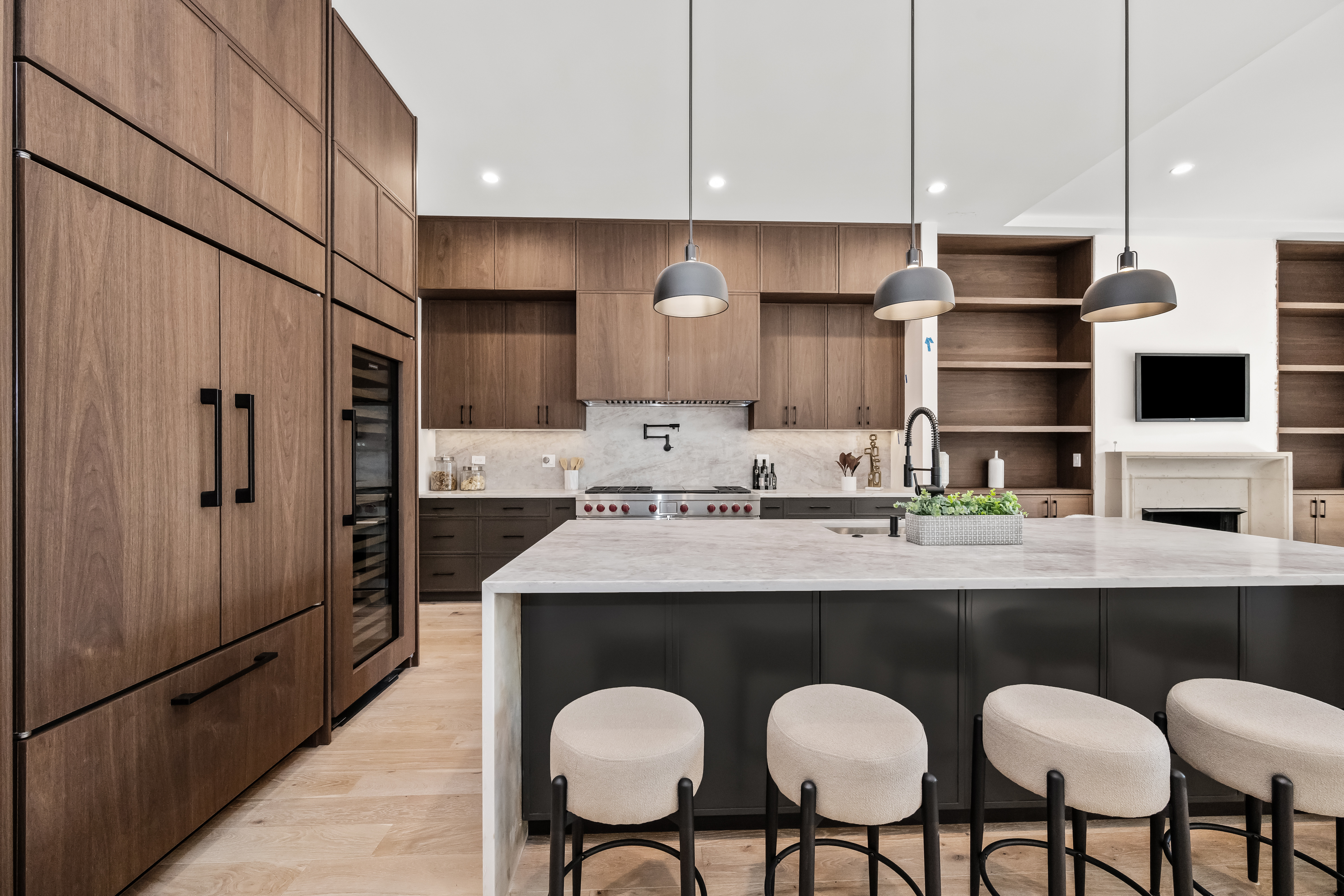 Walnut kitchen cabinetry and island seating