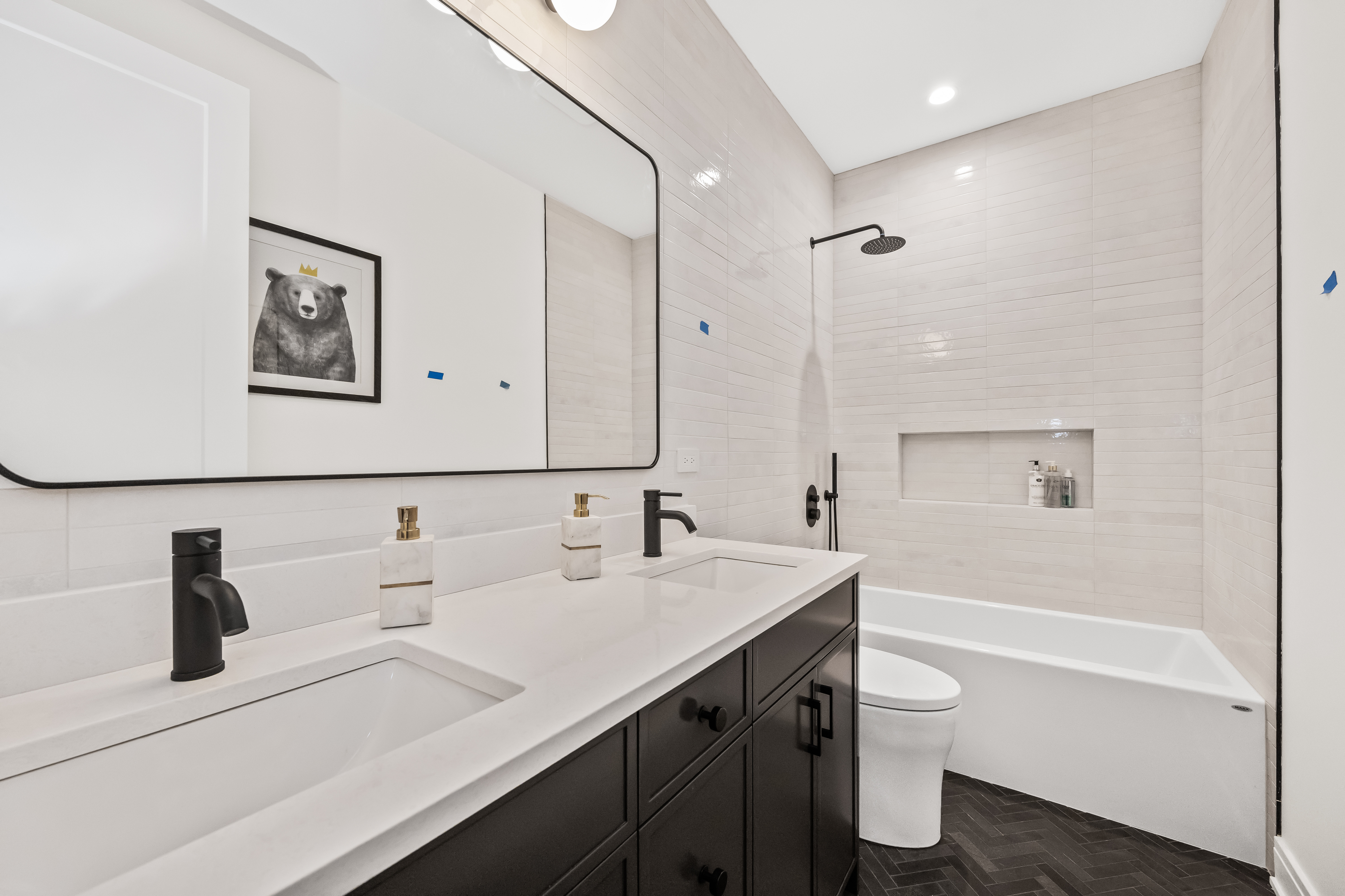 White tile bathroom with double vanity