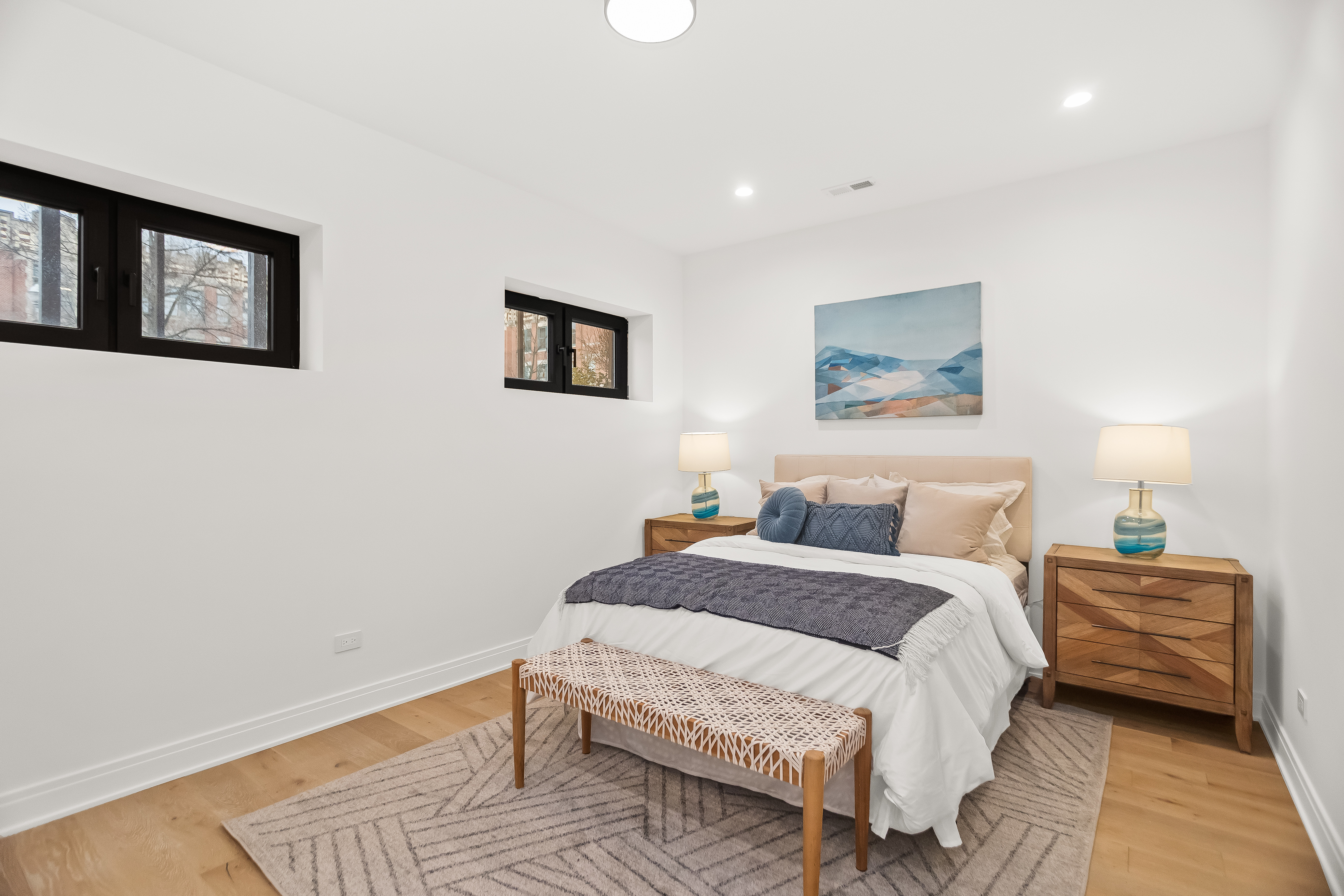Guest bedroom with oak flooring