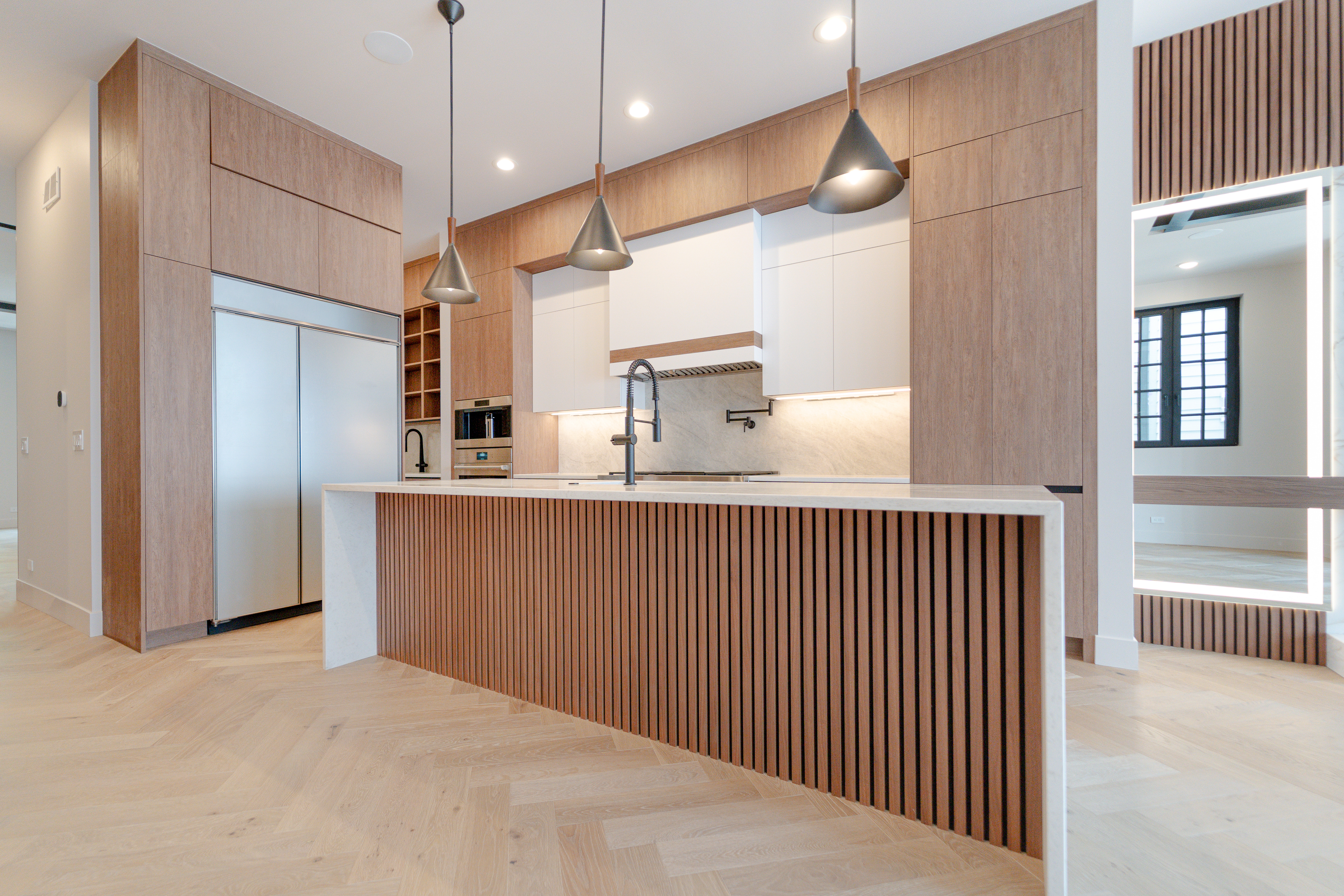 Kitchen with fluted walnut island