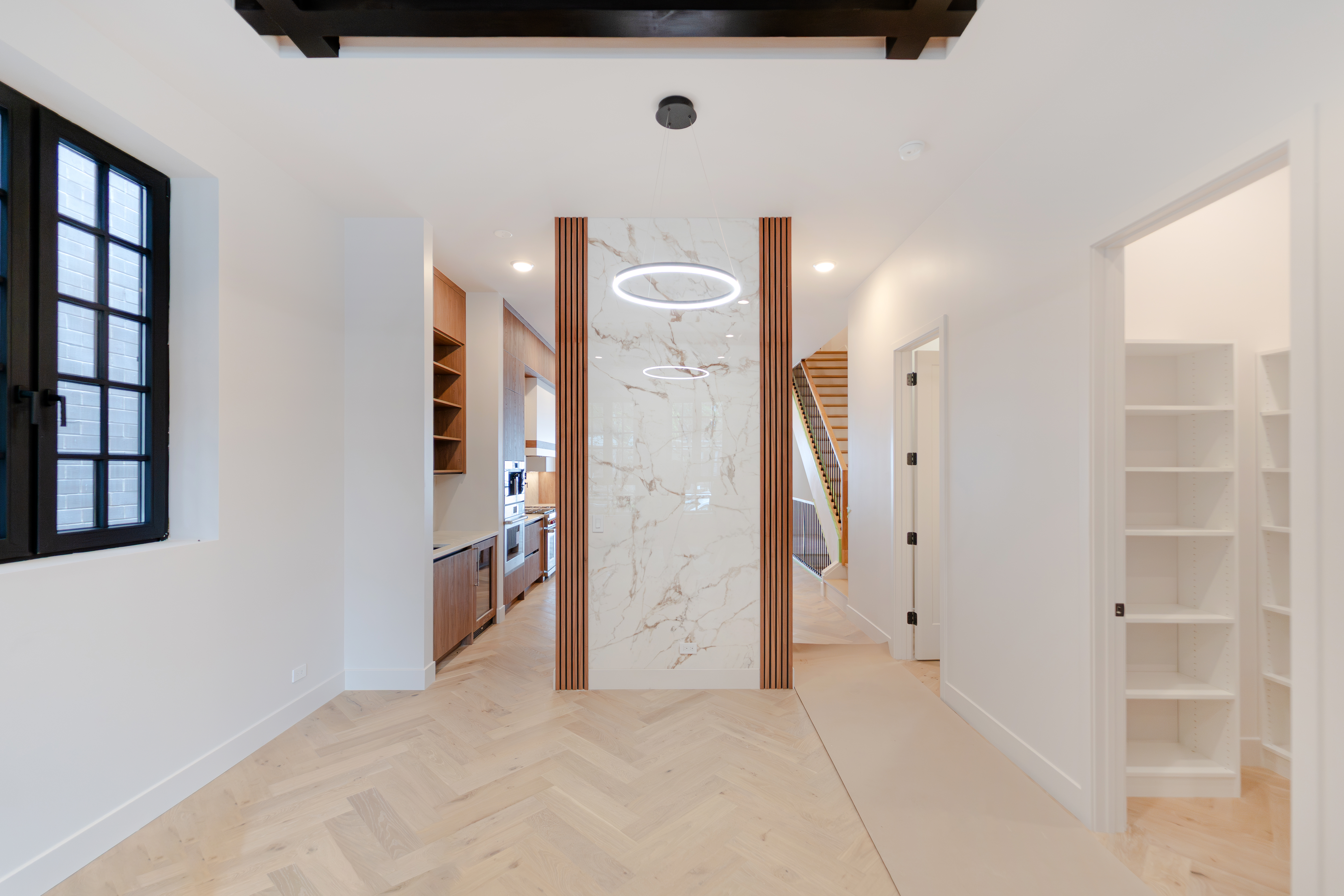 Open living area with marble fireplace wall